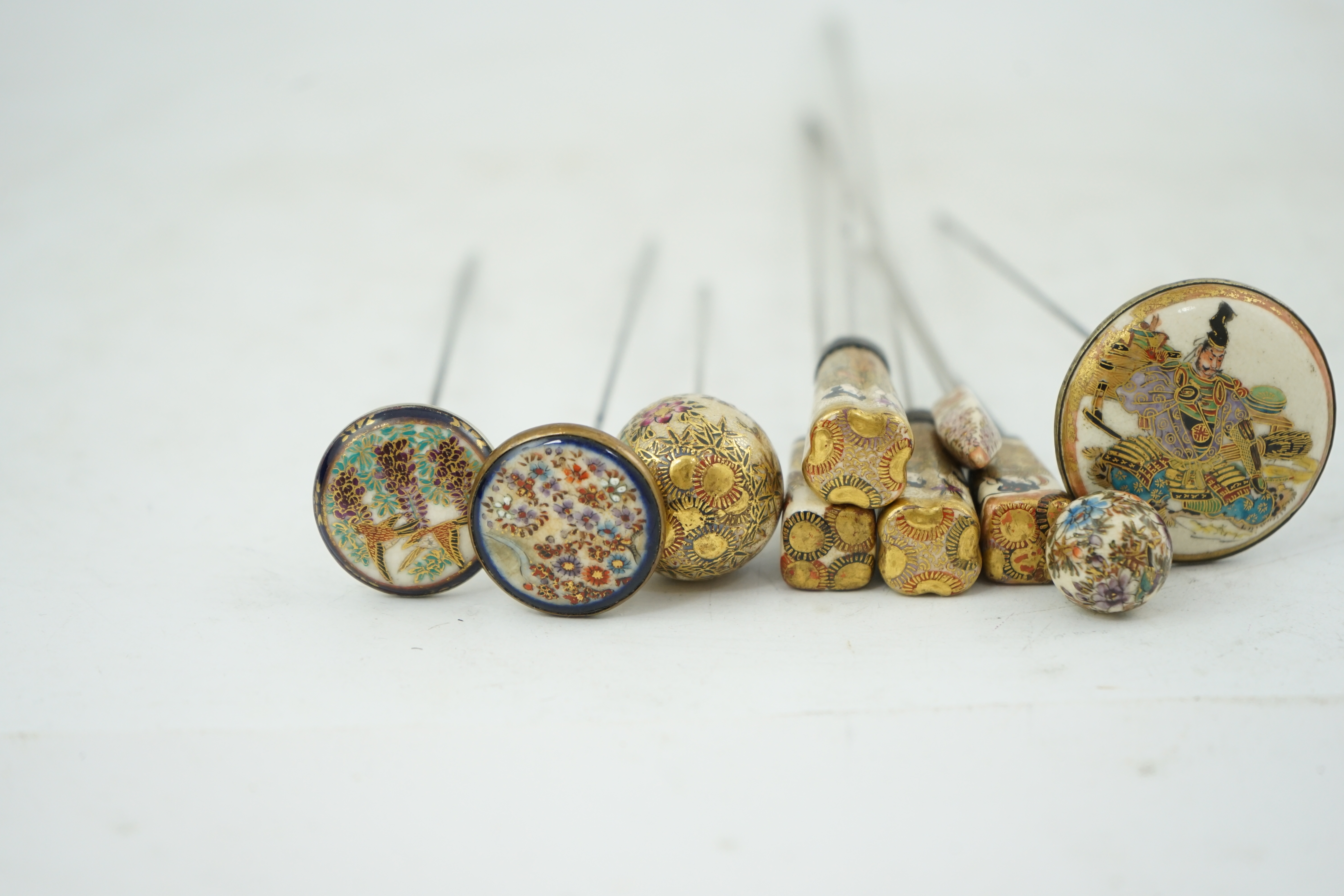 A group of ten Japanese Satsuma topped hair pins, early 20th century